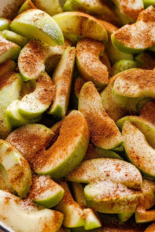 sliced apple wedges topped with cinnamon