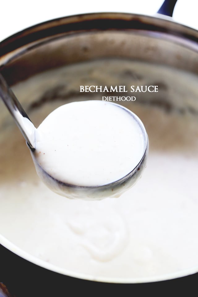 A ladle lifting bechamel sauce from a saucepan.