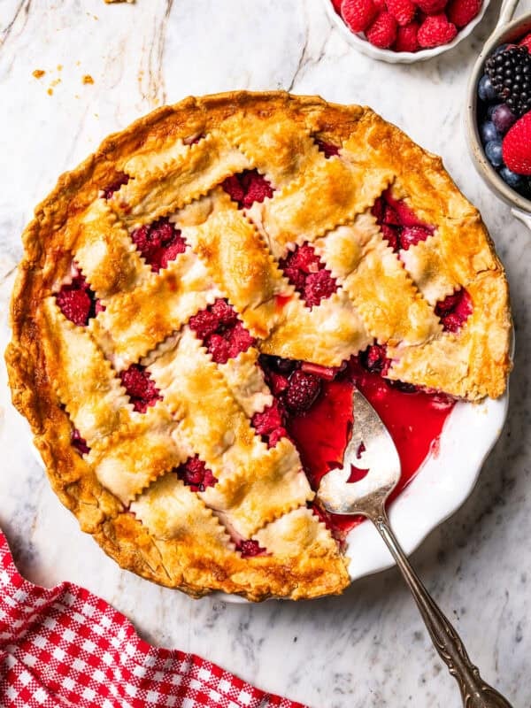 A serving spoon resting in a pie plate.