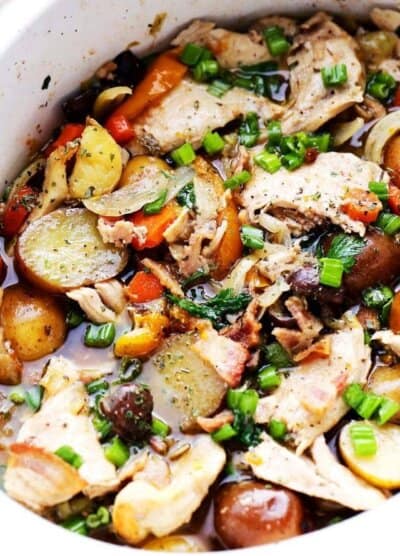 Slow Cooker Coq au Vin - A classic French winter stew with chicken, vegetables, potatoes and mushrooms cooked in wine sauce.