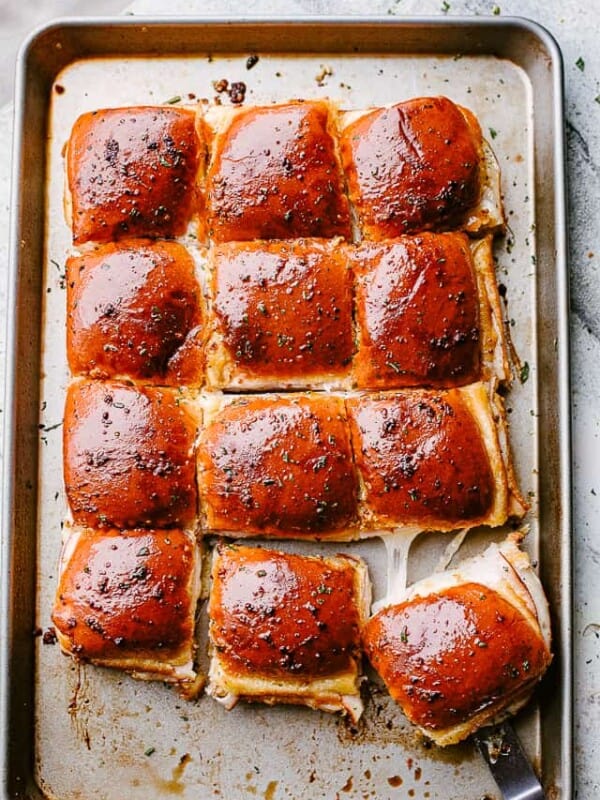 turkey ham and cheese sliders on a baking sheet