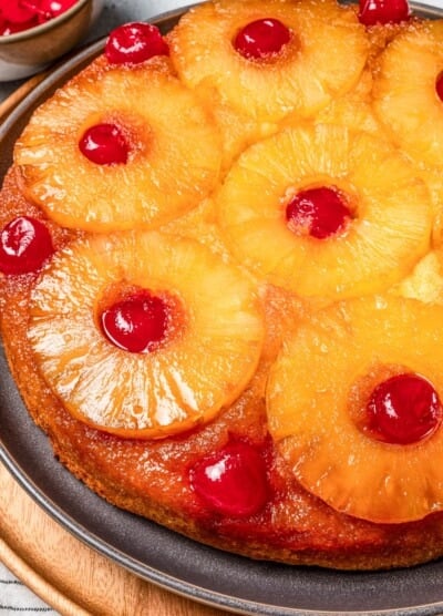 Close-up of a pineapple upside down cake on a plate.