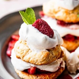 top view of strawberry shortcakes topped with whipped cream and mint