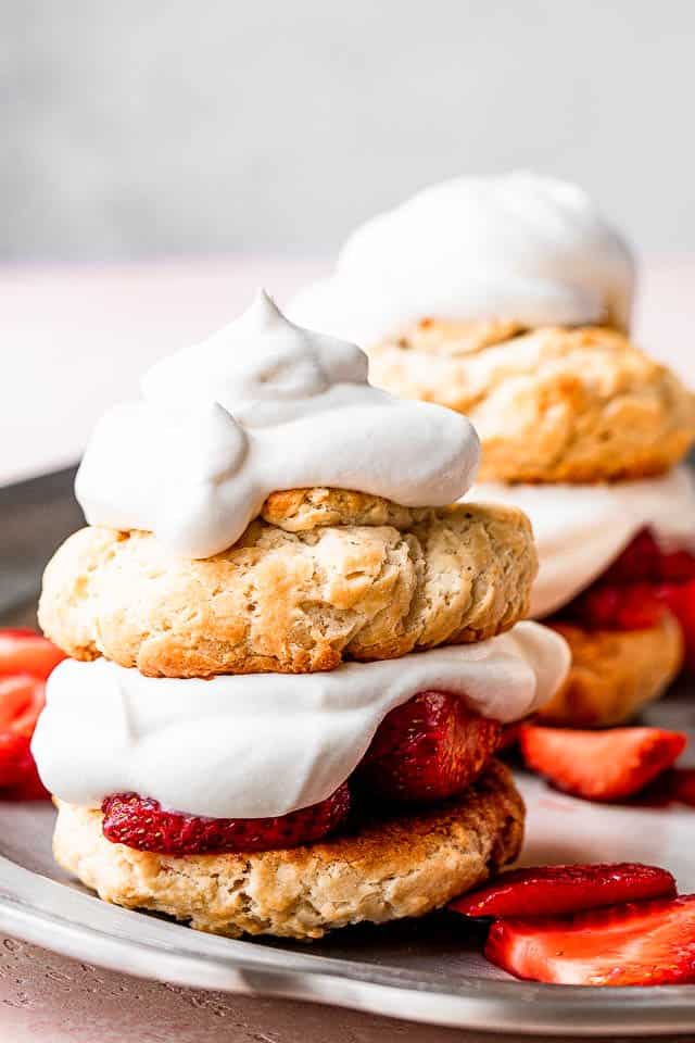 Biscuits with layers of whipped cream and strawberries. 