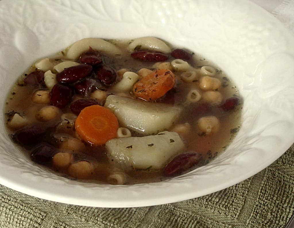 Close-up view of Vegetable Bean Soup in a white bowl