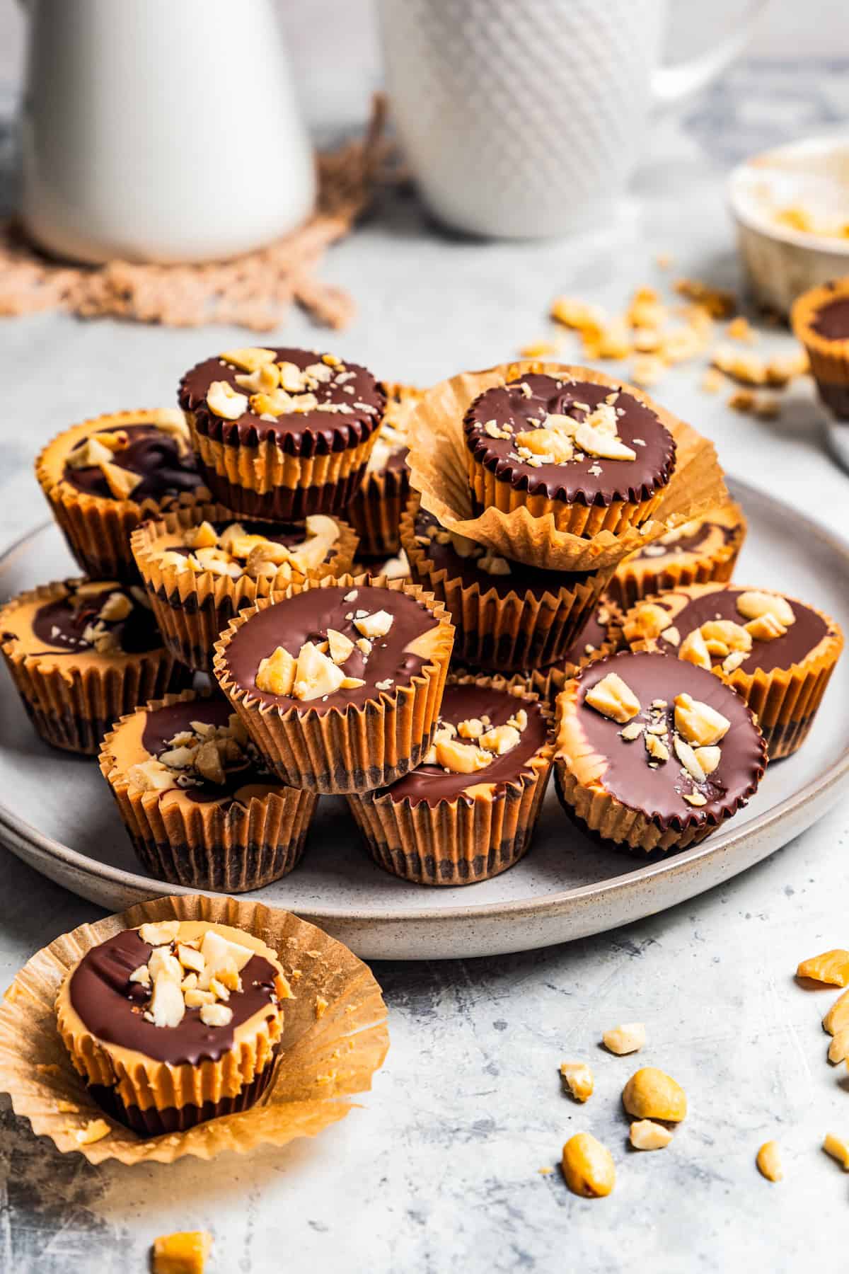 Peanut butter cups piled on a plate.