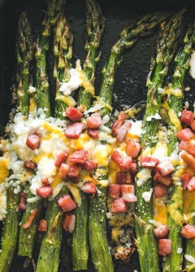 Garlic Roasted Asparagus with Bacon and Cheese - Our Garlic Roasted Asparagus is made with just a few simple ingredients, PLUS bacon and cheese,  and makes for a delicious side dish with any meal! 