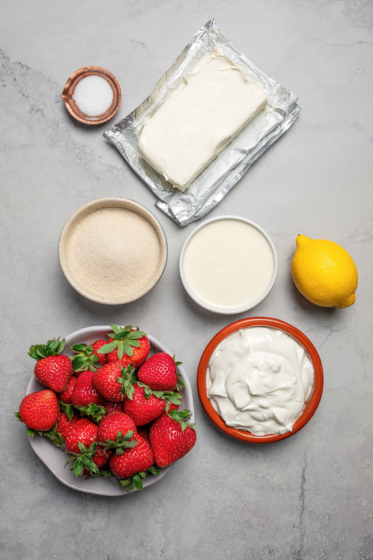 The ingredients for homemade strawberry cheesecake ice cream.