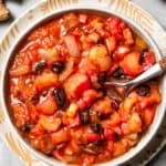 A spoon stirring through homemade chutney.