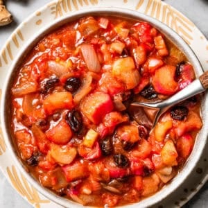 A spoon stirring through homemade chutney.