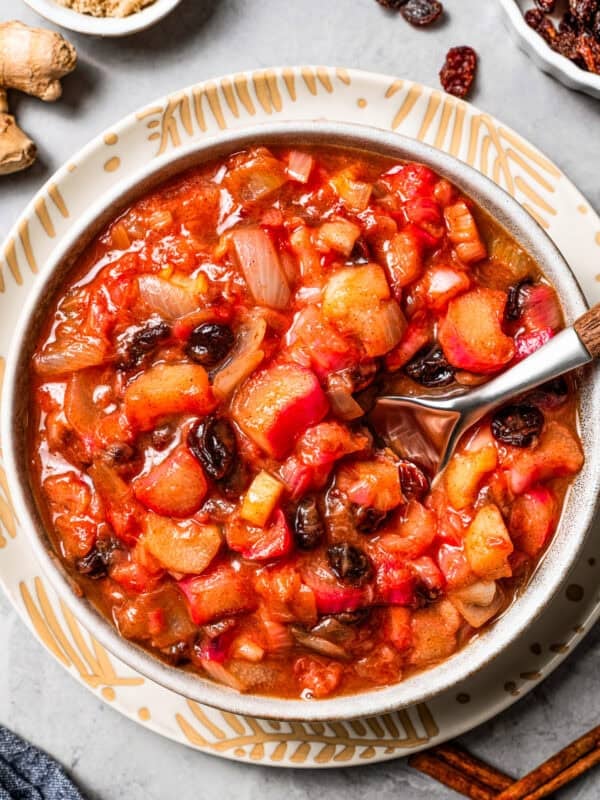 A spoon stirring through homemade chutney.