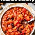 Rhubarb chutney served in a bowl with text overlay of the recipe's title.