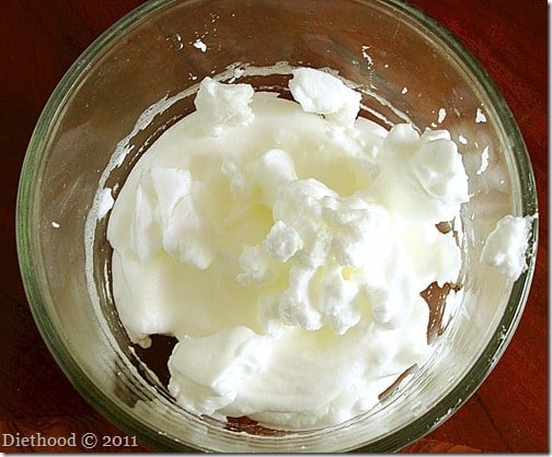 whipped egg whites in a mixing bowl