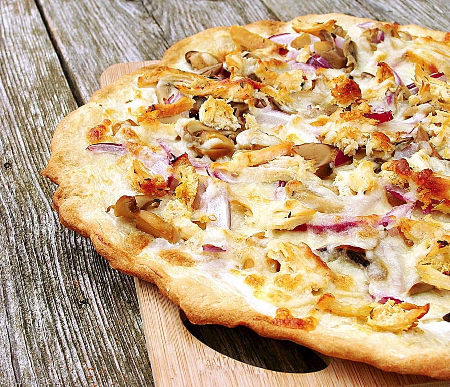 grilled pizza on a picnic table.