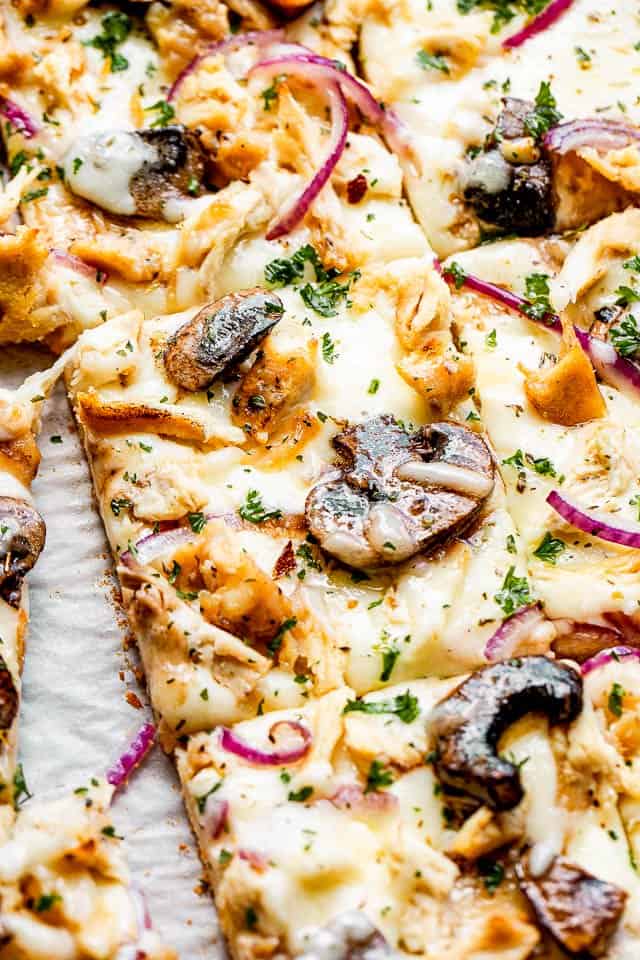 squared slice of pizza topped with chicken and mushrooms