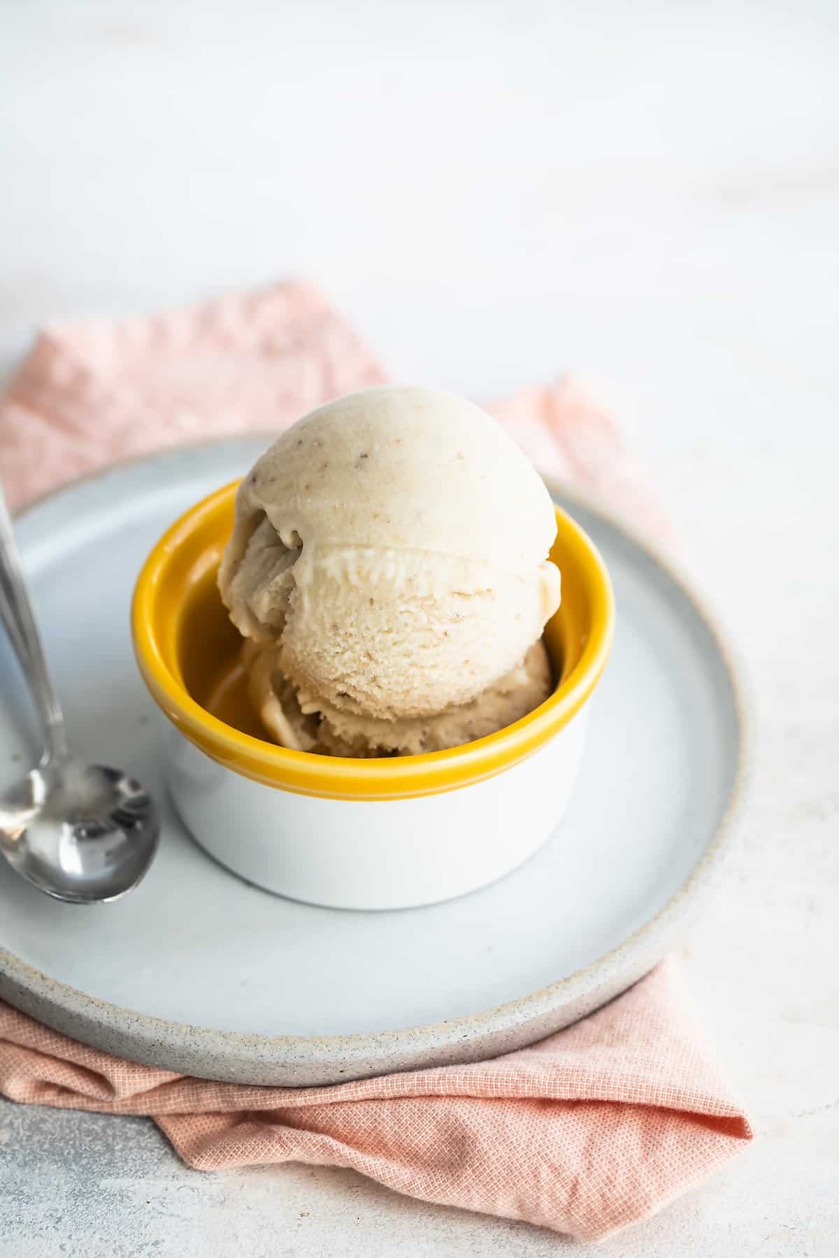 Bowl of frozen yogurt with a spoon.