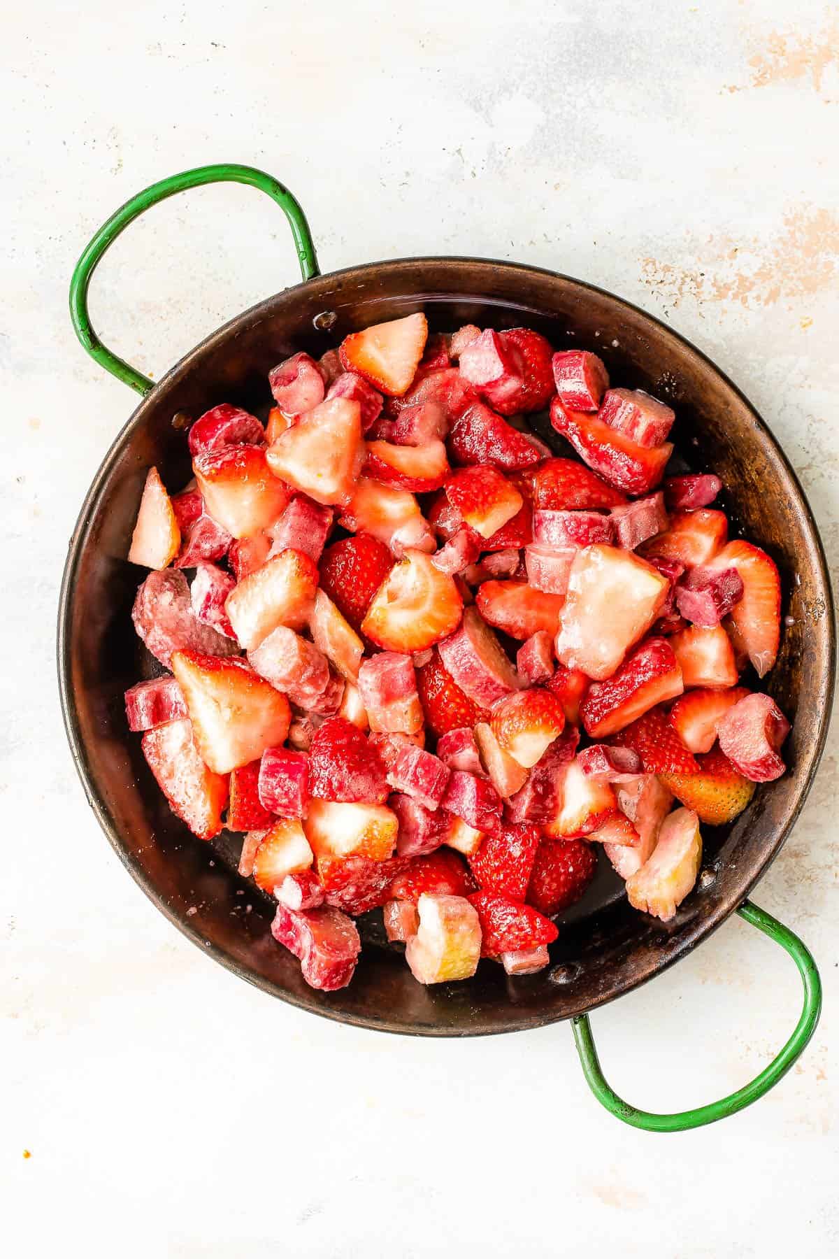 Strawberries and rhubarb in a pan.