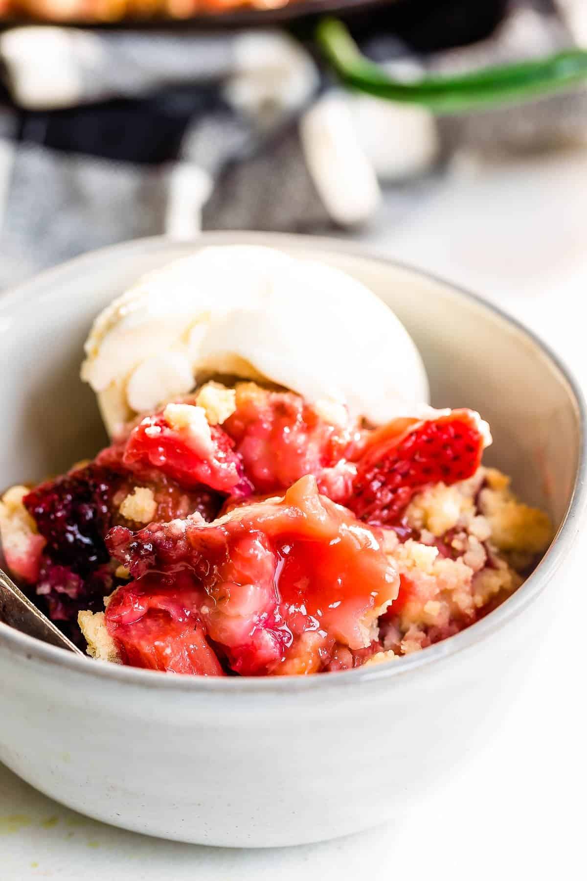 Vanilla ice cream with strawberry rhubarb crumble.