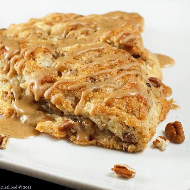 Close-up of Toffee Coffee Pecan Scone with Kahlua glaze on a plate