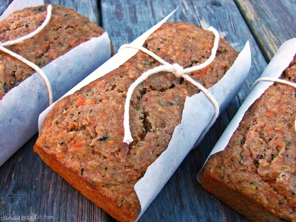 Fruit and veggie bread loaves tied in sheets of parchment paper.