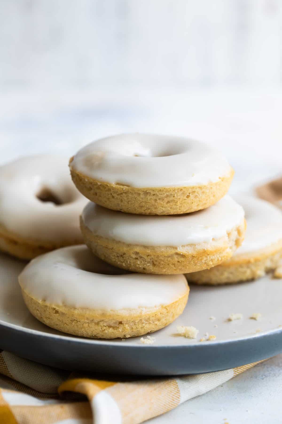 Stacked vanilla-glazed donuts.