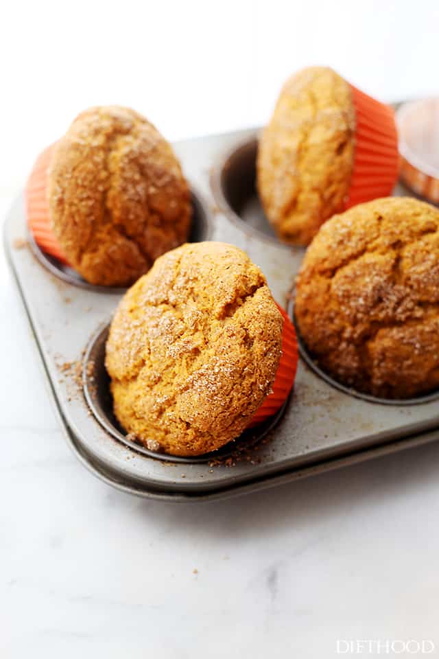 Muffins topped with cinnamon sugar removed from a baking tray