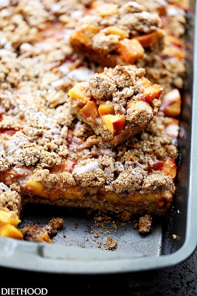 Peach Crumb Bars - Sweet, fruity, delicious bars made with fresh peaches tucked inside a lightened-up buttery crust.
