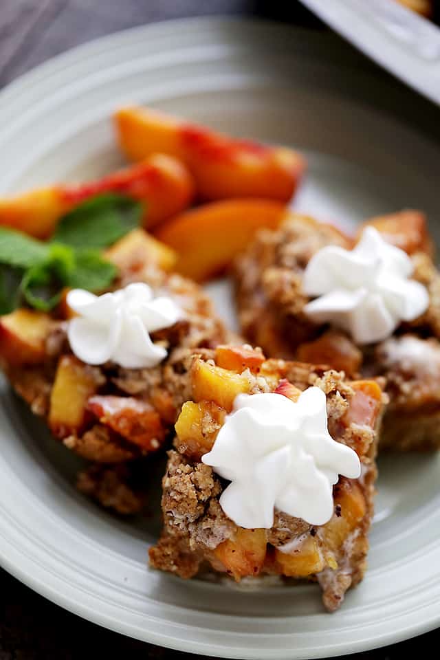 Peach Crumb Bars - Sweet, fruity, delicious bars made with fresh peaches tucked inside a lightened-up buttery crust.