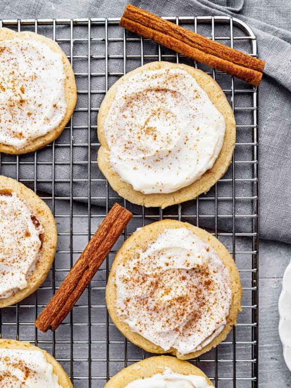 A Close-Up Shot of Frosted Cinnamon Swirl Cookies on a Metal Cooling Rack