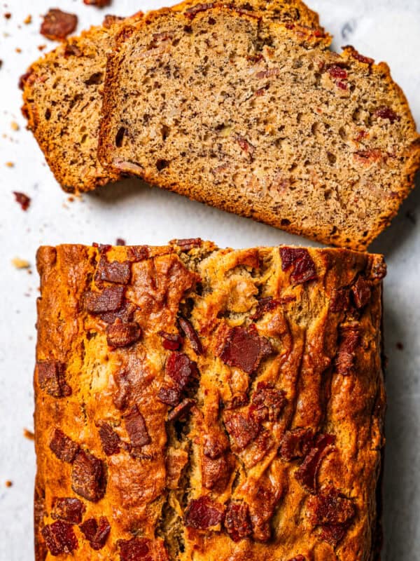 Overhead view of a peanut butter banana bread loaf with slices cut from the end.