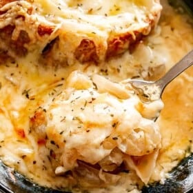 Crockpot French onion soup in a spoon.