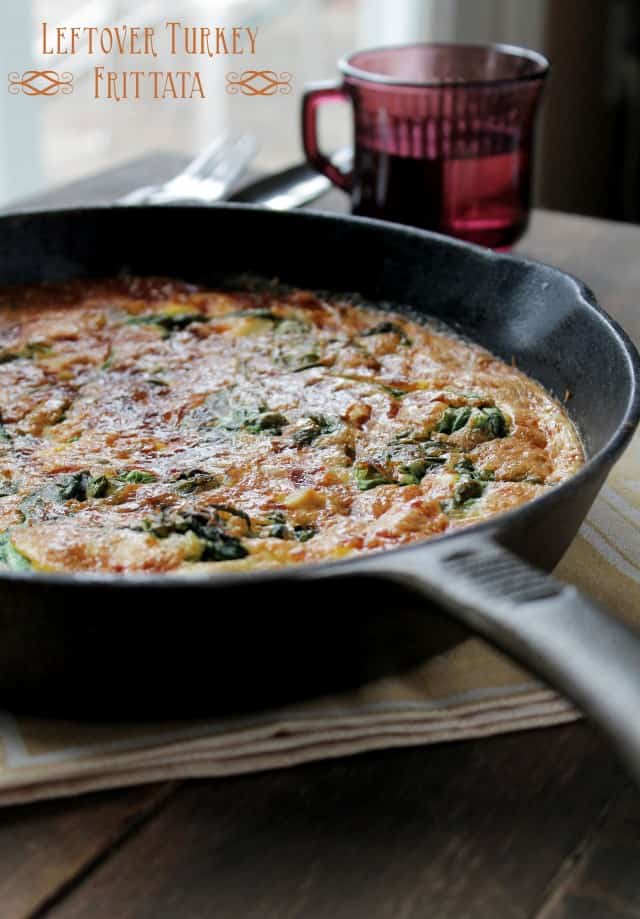 Leftover turkey frittata with spinach and mozzarella in a cast iron skillet.