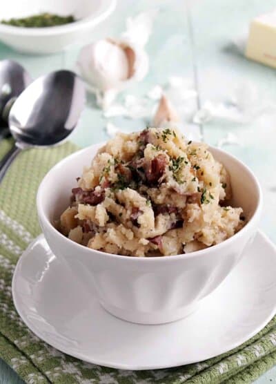 Slow cooker country style garlic mashed potatoes in a bowl.