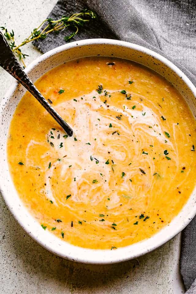 Potato Leek Soup in a bowl with a spoon.