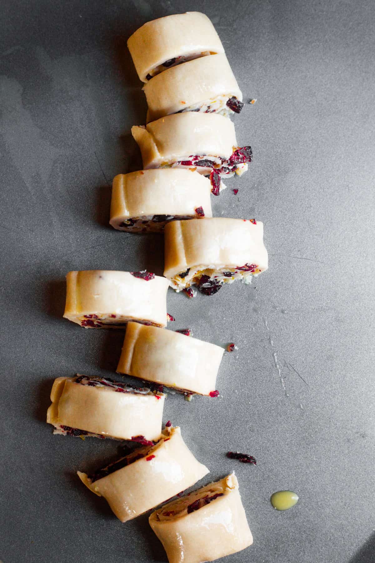 Overhead image of cut-up pie crust pinwheels.