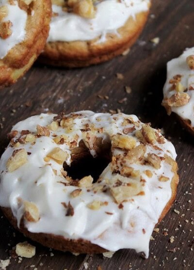 Baked Carrot Cake Doughnuts | www.diethood.com | Baked Carrot Cake Doughnuts frosted with Pineapple Cream Cheese Frosting and topped with Toasted Walnuts | #recipe #doughnuts #carrotcake #dessert