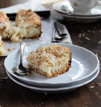Coconut Milk Bars | www.diethood.com | Moist, gooey, extra sweet Coconut Milk Bars made with milk, shredded coconut, and a sprinkle of hazelnuts | #recipe #cookies #desserts #coconut