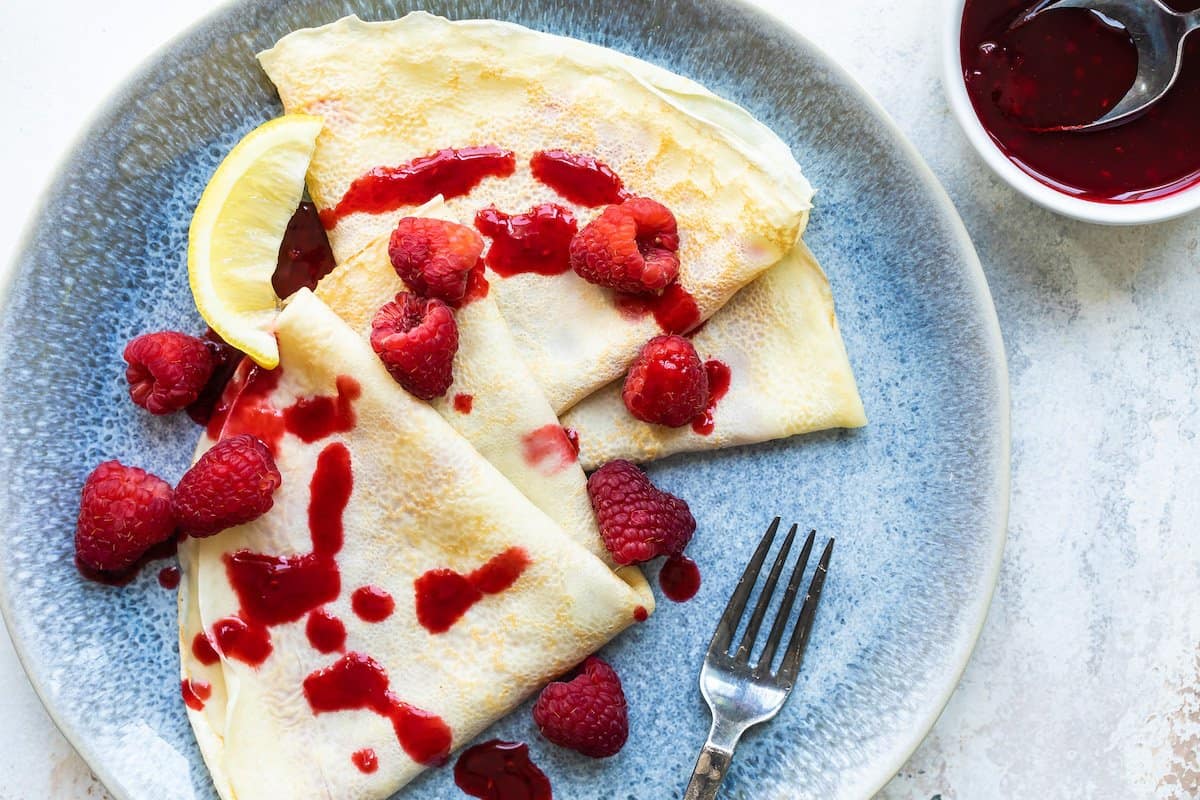 Crepes with fresh raspberries.