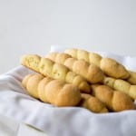 Braided Butter Cookies on a white cloth in a bowl