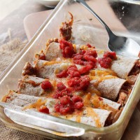 Chicken Enchiladas | www.diethood.com | Rolled tortillas loaded with chicken, tomatoes and a creamy, cheesy sauce | #recipe #dinner #tacos #enchiladas