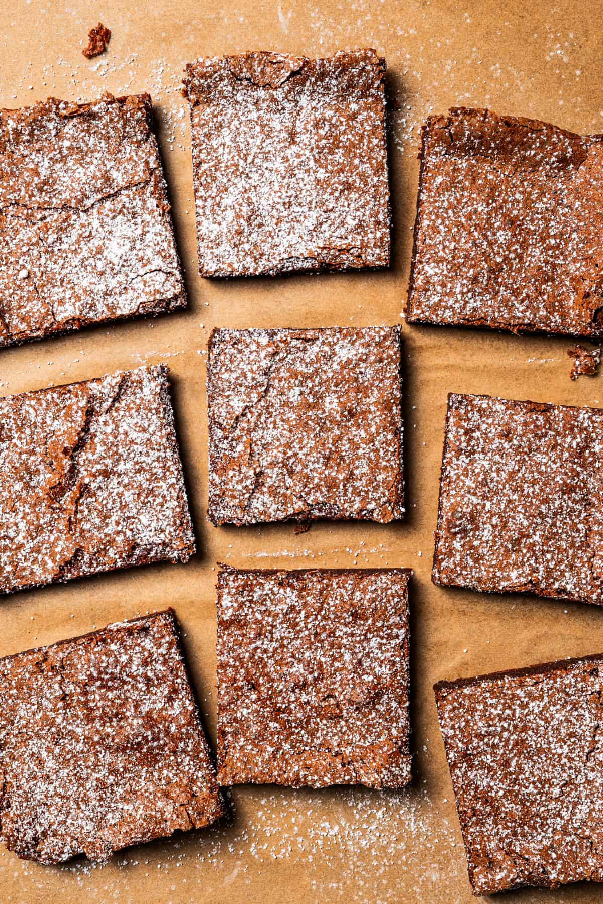 Make fudgy Nutella brownies by whipping eggs and adding Nutella. That's it! These brownies are extra chocolatey and naturally gluten-free. Nutella brownies dusted with powdered sugar.