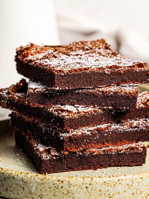 Nutella brownies stacked up on a plate.