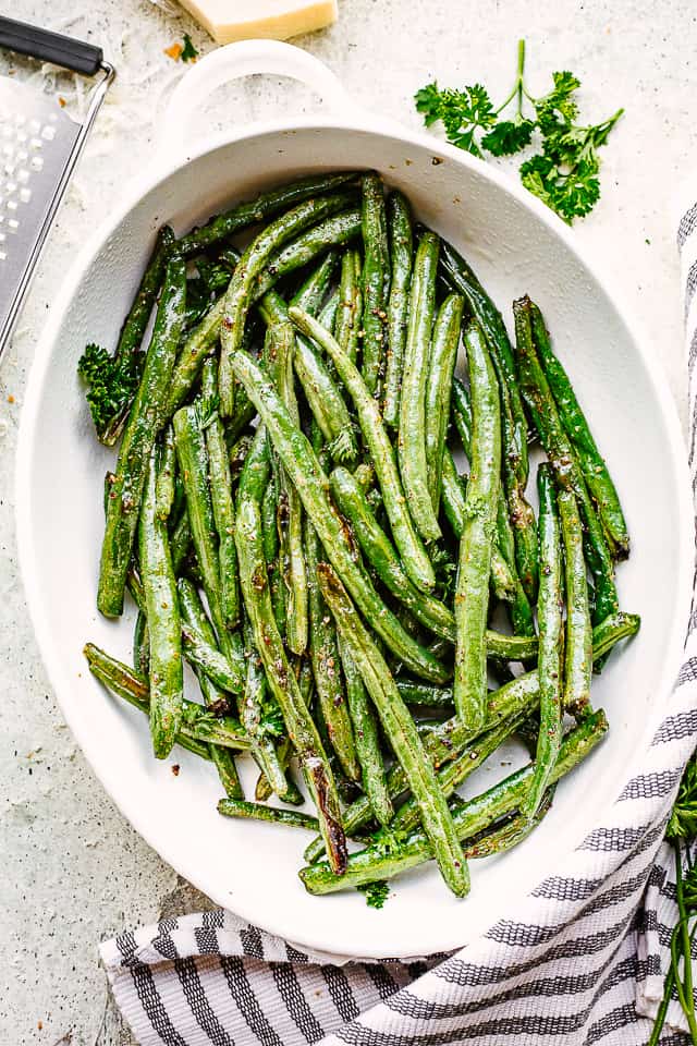 Roasted green beans served in a casserole dish.