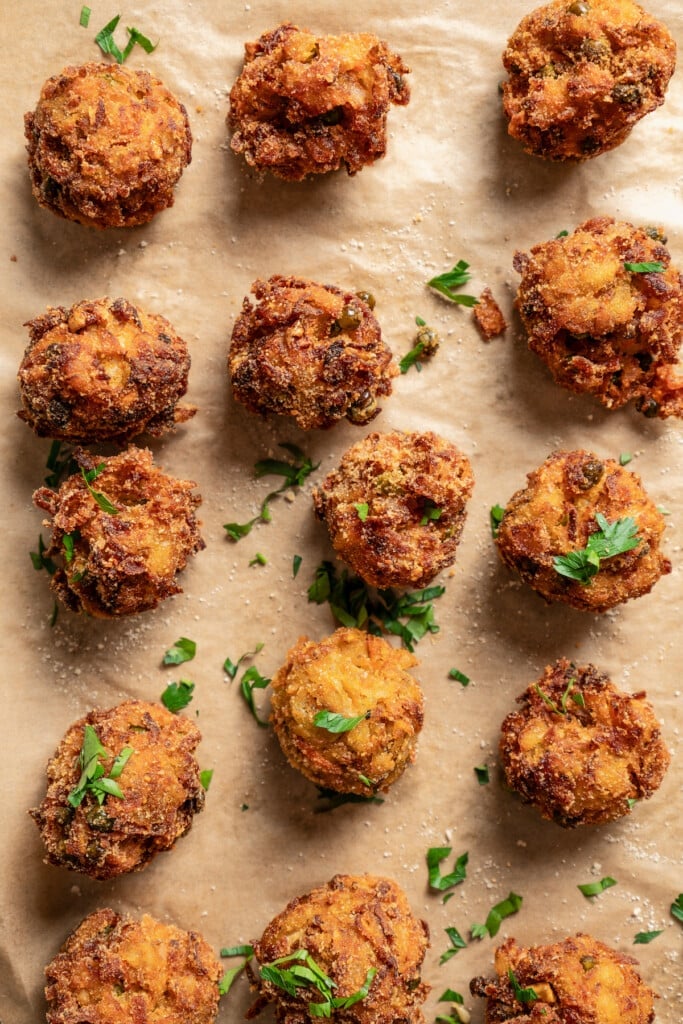 Fried meatballs with fresh parsley on top. 