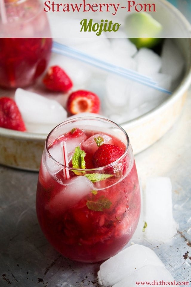Strawberry Pom Mojito in a stemless wine glass with fresh mint