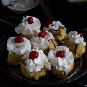 Banana Split Cream Puffs | www.diethood.com | Classic cream puffs filled with pineapple chunks, vanilla pudding, and banana | #recipe #dessert #bananasplit