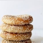 Stack of four homemade sesame bagels.