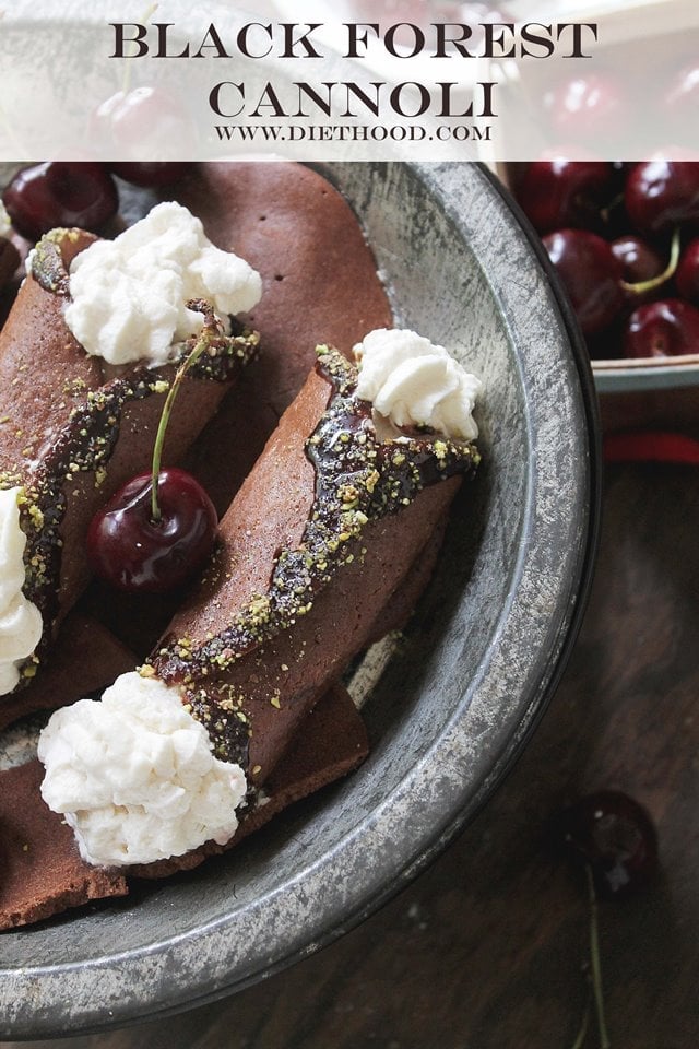Chocolate cannoli shells are filled with whipped cream in a dark bowl 