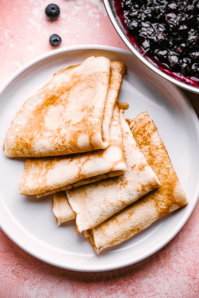 folded crepes on a plate