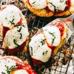 Chicken parmesan cooling on a cooling rack.